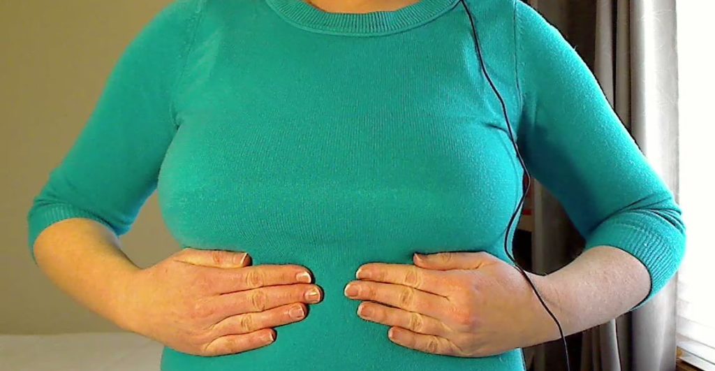 Touching ribs under chest